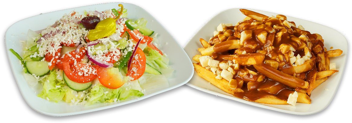 Plate of poutine next to plate of salad
